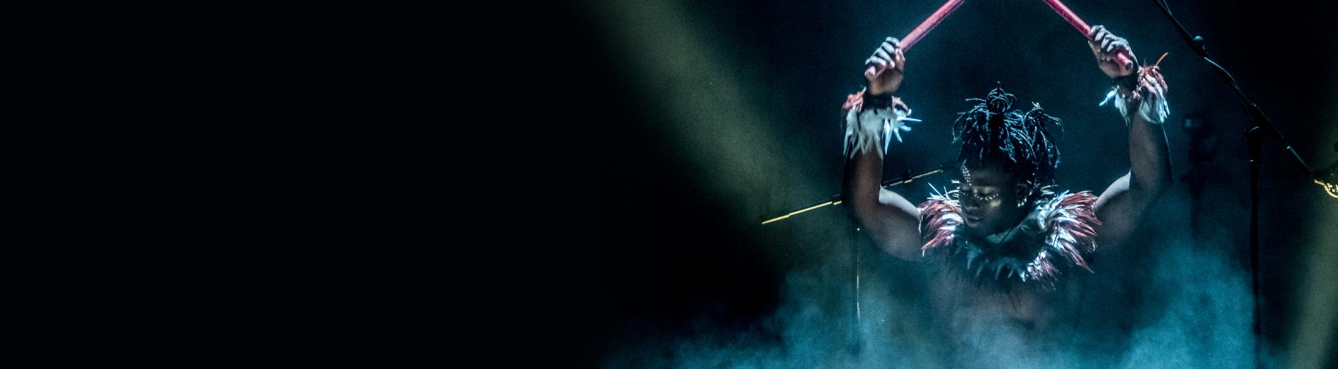 A member of Cirque Kalabanté on the drums.